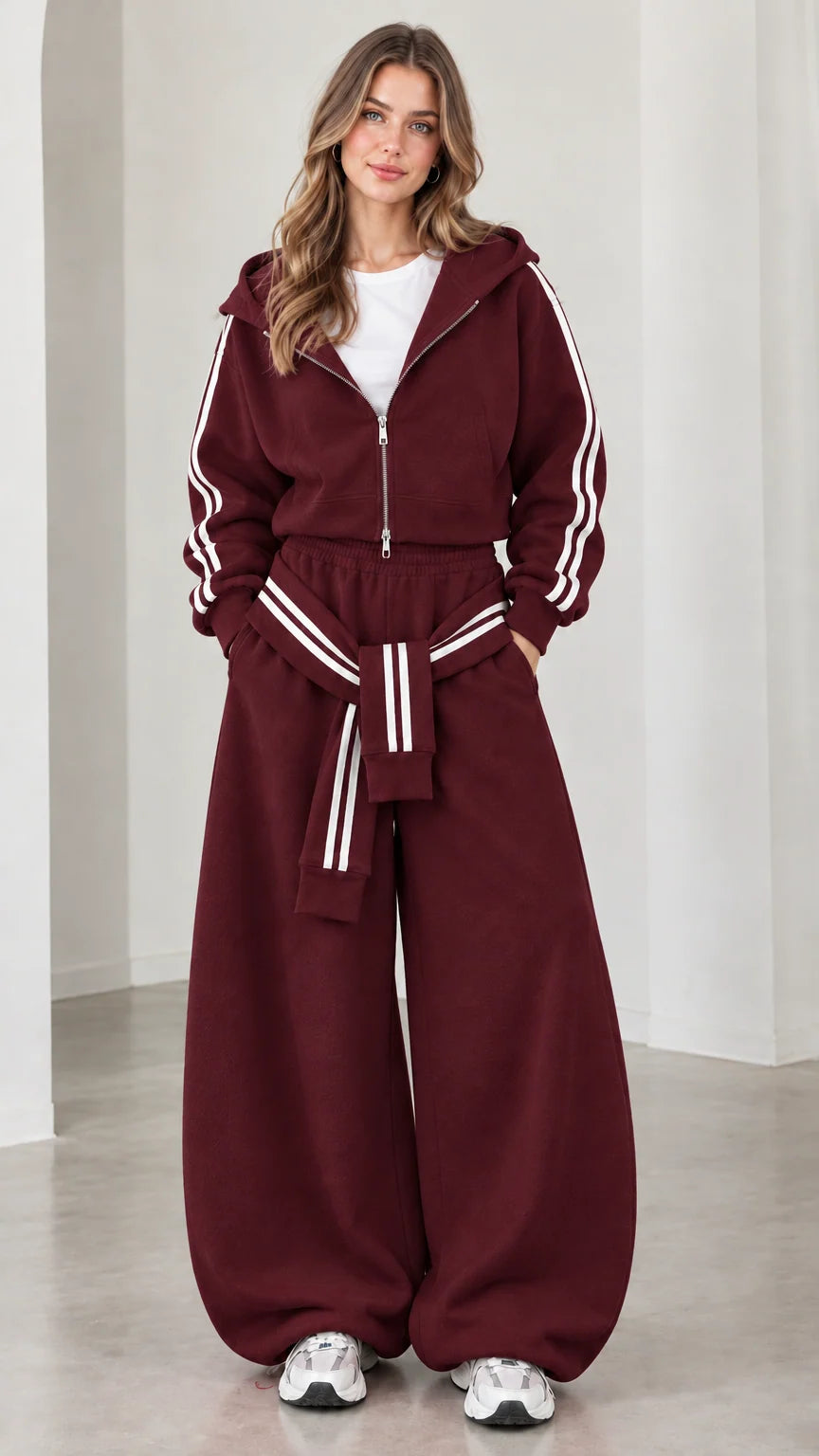 Model wearing burgundy cropped hoodie and wide-leg sweatpants set