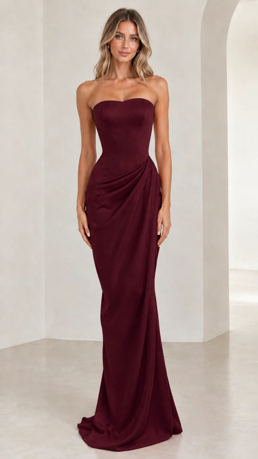 Model wearing deep burgundy strapless sweetheart formal evening gown