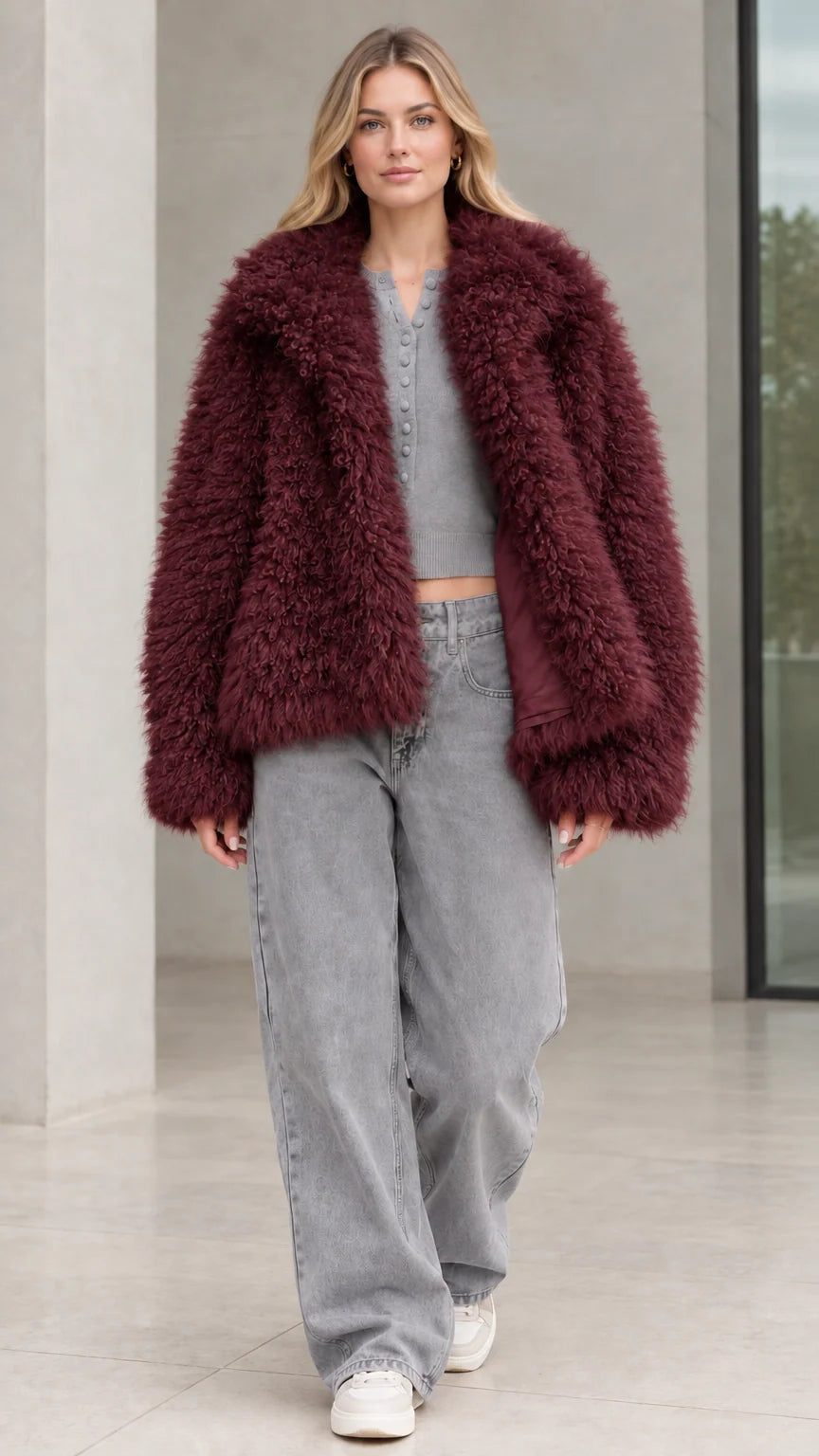 Front view of model wearing burgundy wine shaggy faux fur jacket