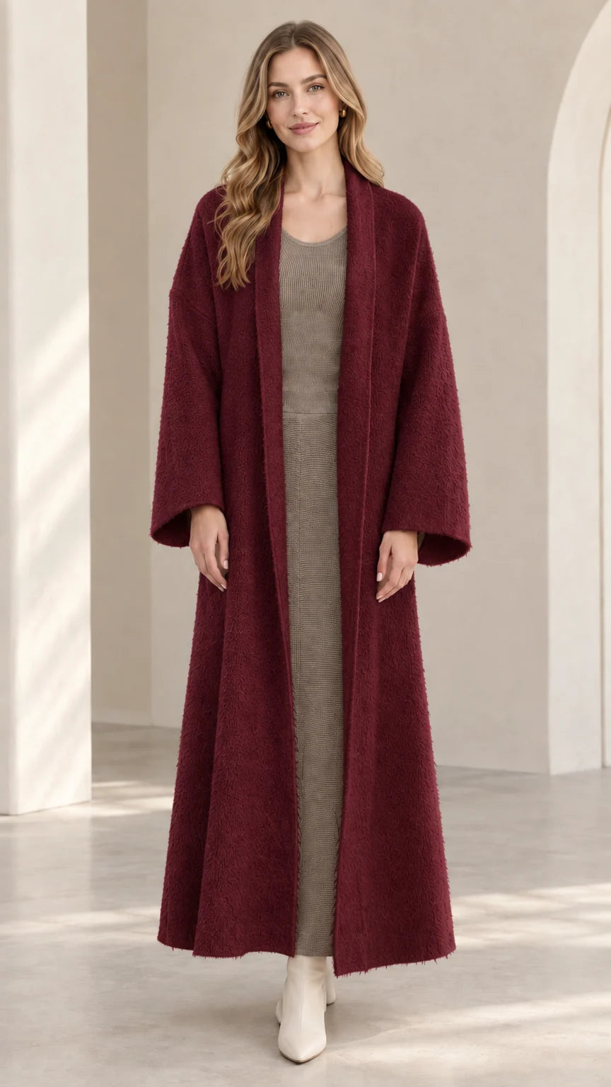Front view of model wearing burgundy wine-red textured maxi duster coat