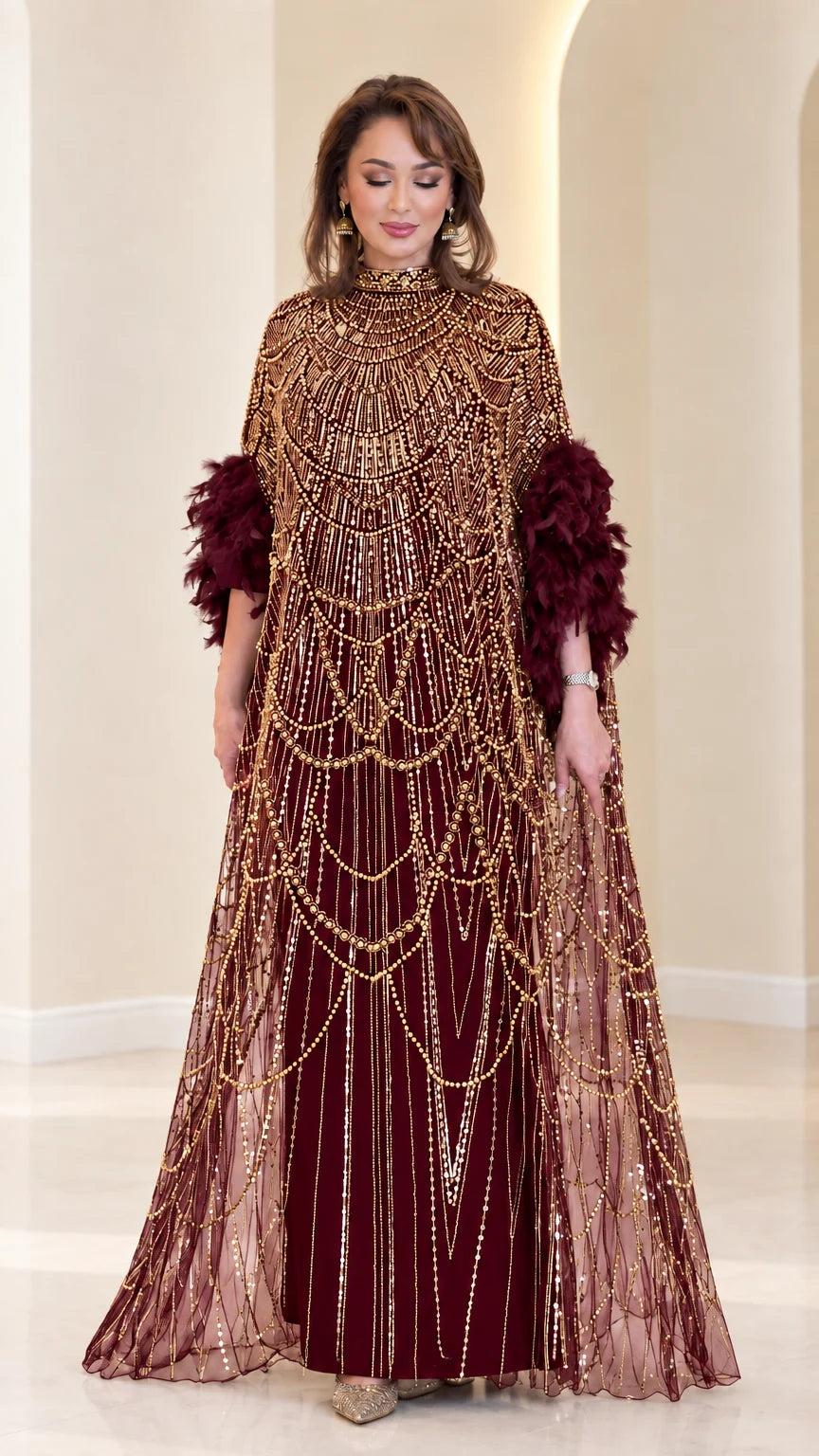 Burgundy wine beaded cape evening gown with feather accents