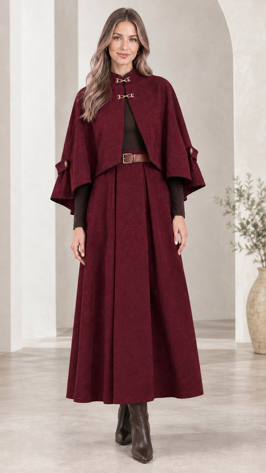 Front view of woman wearing Burgundy wine red cape and pleated maxi skirt set