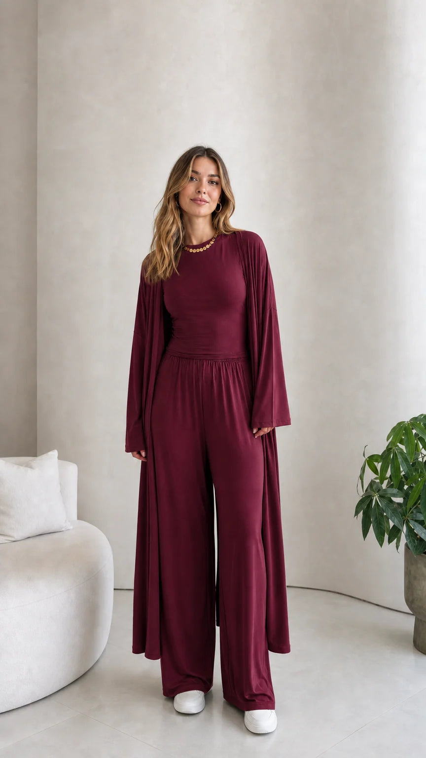 Front view of model wearing the 3-piece duster cardigan and pants set in burgundy wine