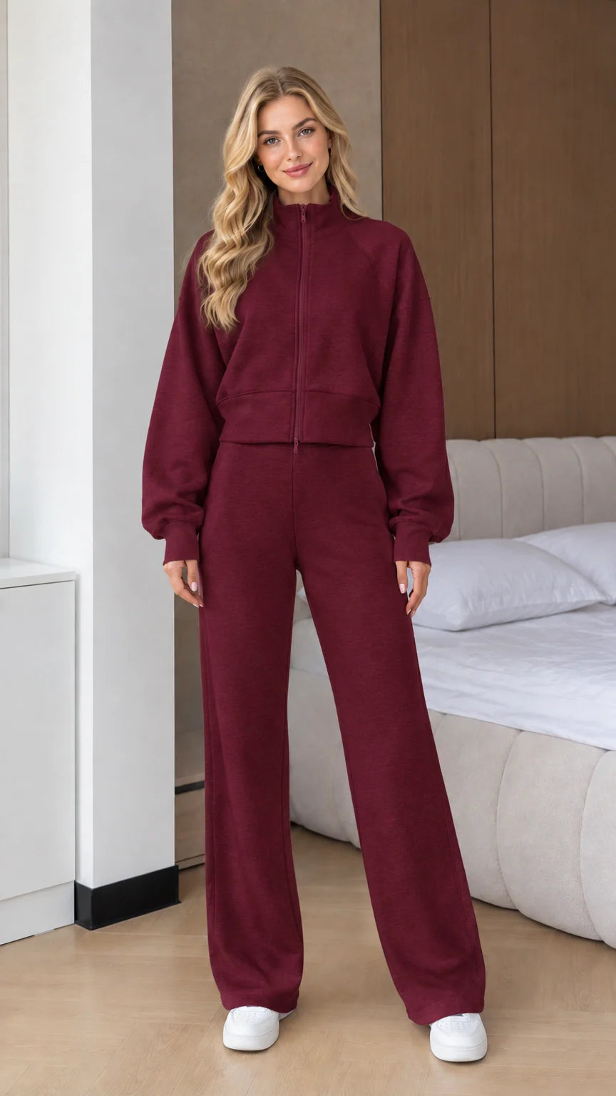 Front view of woman wearing Burgundy 2-piece zip-up sweatshirt and wide leg pants set