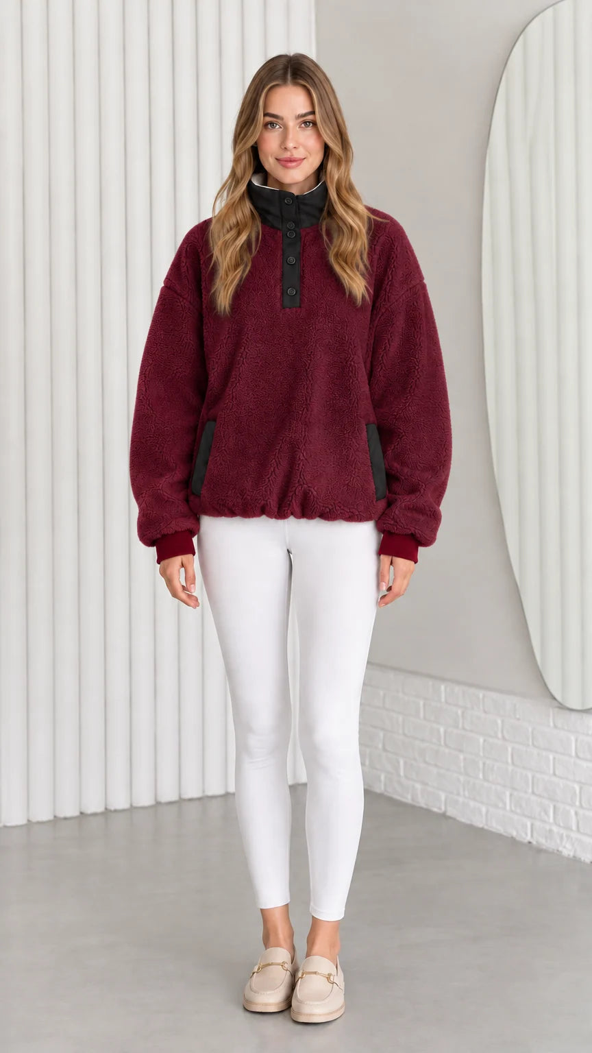 Model wearing burgundy red sherpa fleece pullover sweatshirt