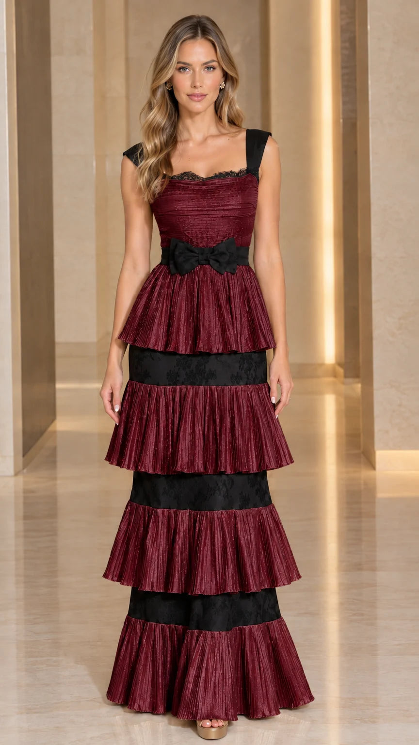 Front view of Burgundy wine red tiered pleated maxi evening gown with black contrast details