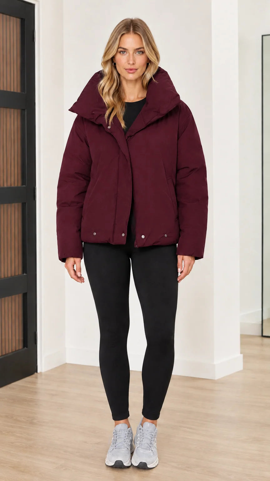 Front view of woman wearing burgundy wine red funnel collar puffer jacket