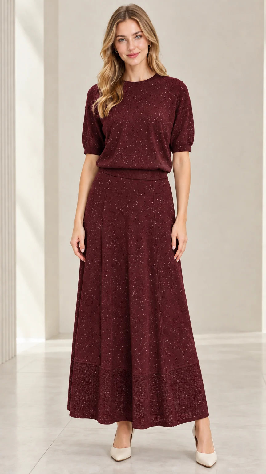 Model wearing burgundy wine red two-piece shimmer knit skirt set