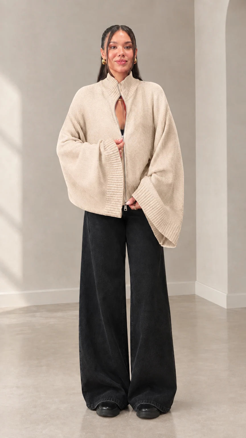 Woman wearing cream beige batwing sleeve zip cardigan