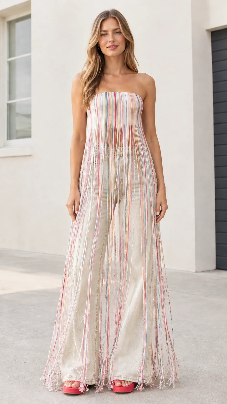 Model wearing multicolor cream striped maxi fringe strapless tube top with off-white jeans