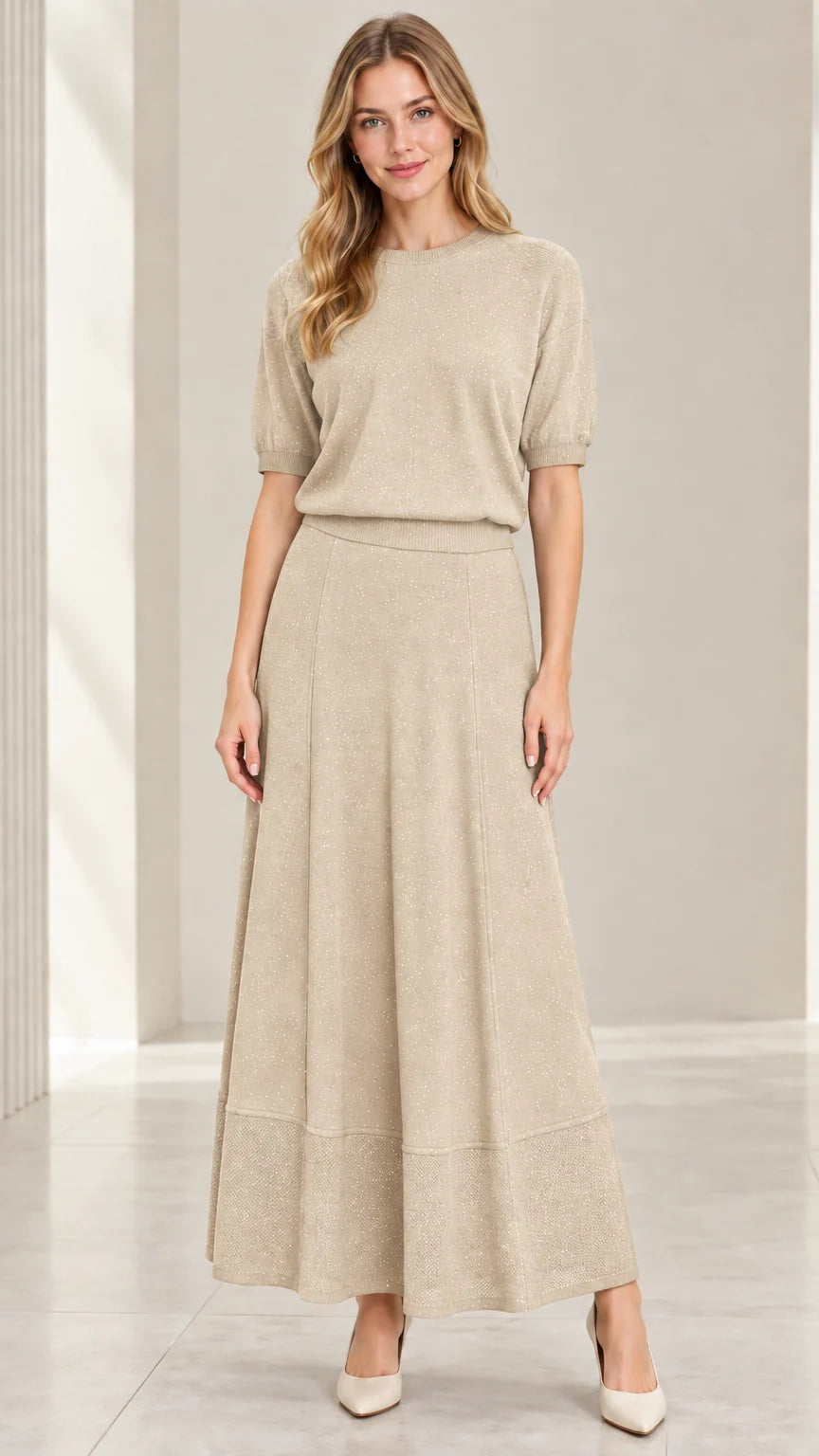 Model wearing champagne beige metallic sparkle knit top and maxi skirt set