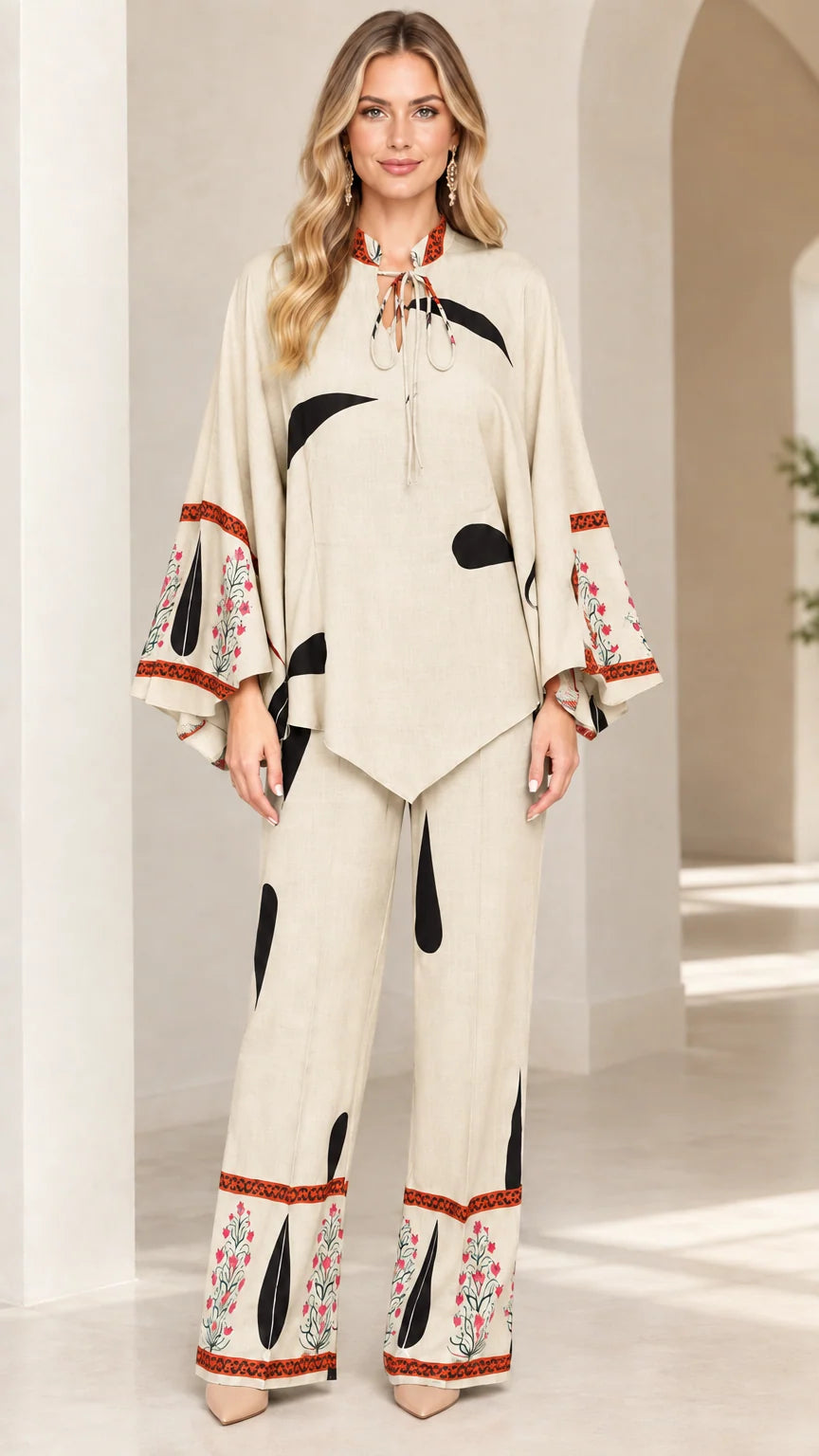 Front view of women's beige cream printed tunic and wide-leg pants set