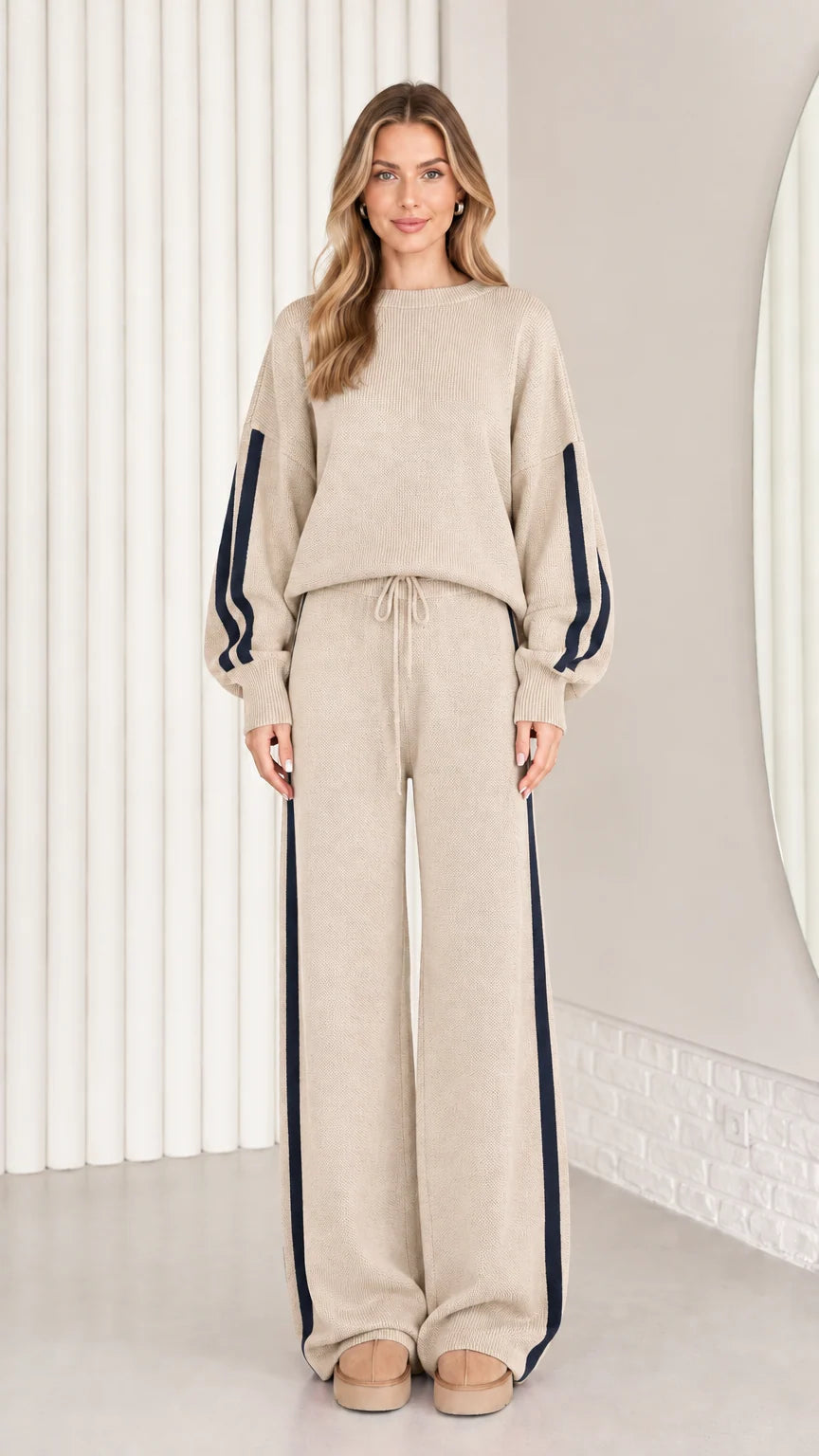 Front view of model wearing beige oatmeal knit two-piece lounge set with navy stripes
