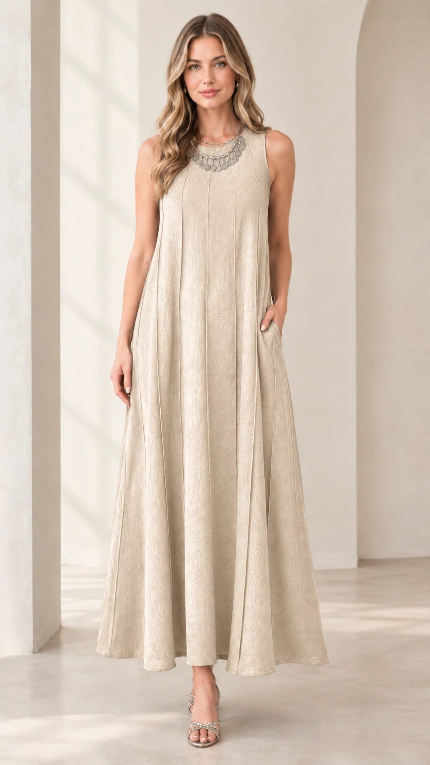 Front view of woman wearing beige sleeveless panel swing maxi dress with pockets