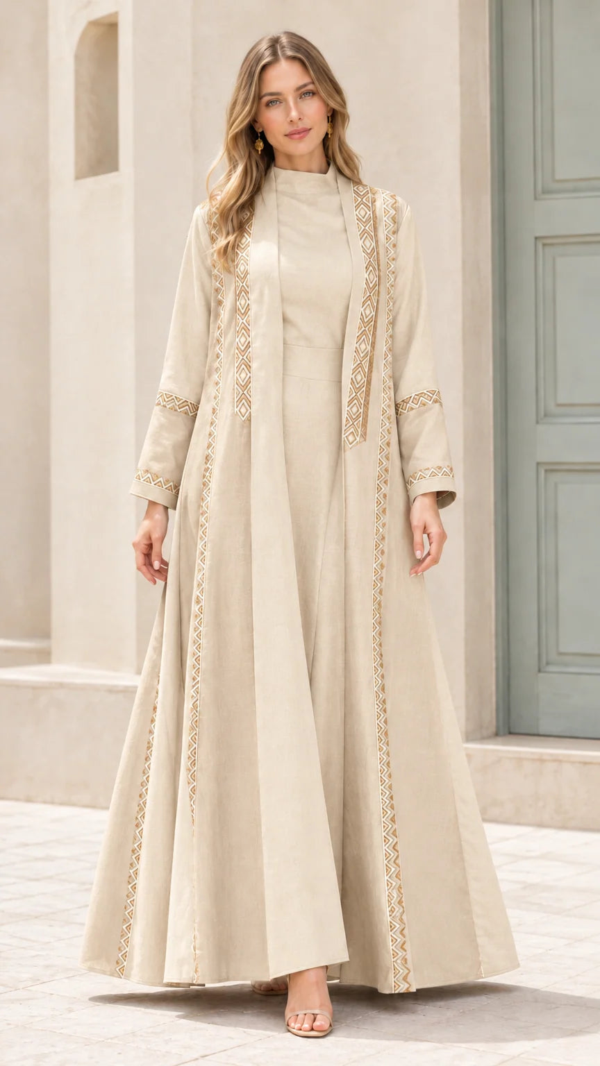 Full-length view of beige monochromatic embroidered two-piece abaya set