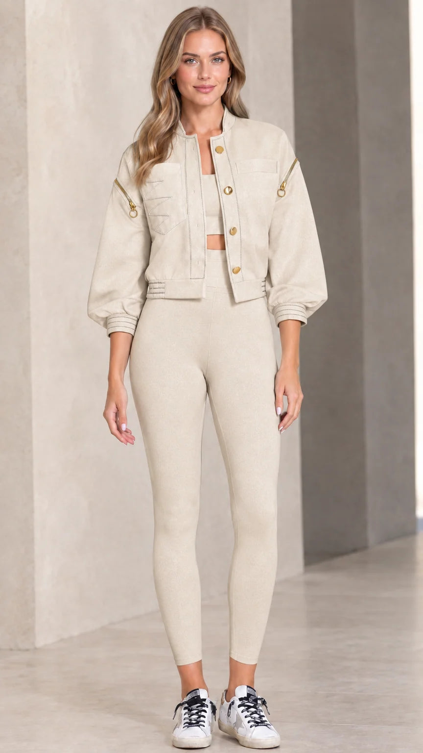 Model wearing beige cropped utility jacket with snap front and contrast details