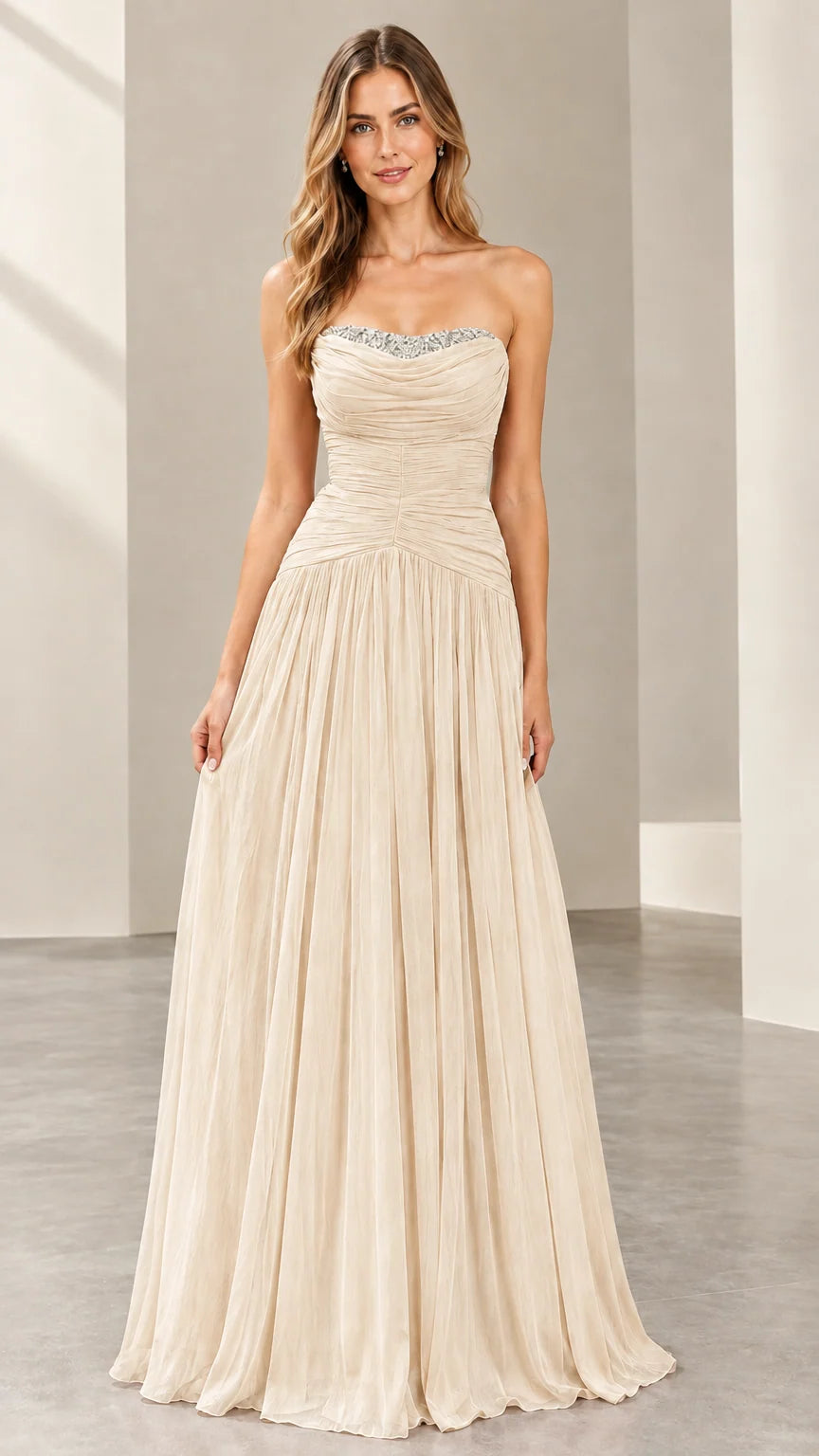 Front view of woman wearing the strapless ruched evening gown in champagne cream