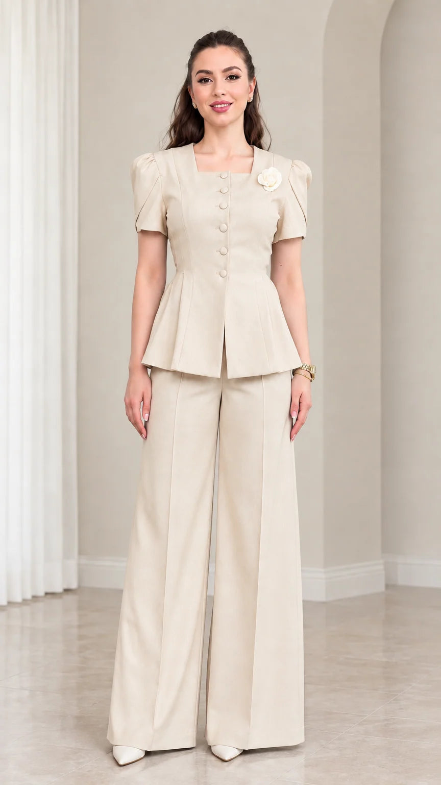 Model wearing Beige short sleeve peplum top and wide leg pants set