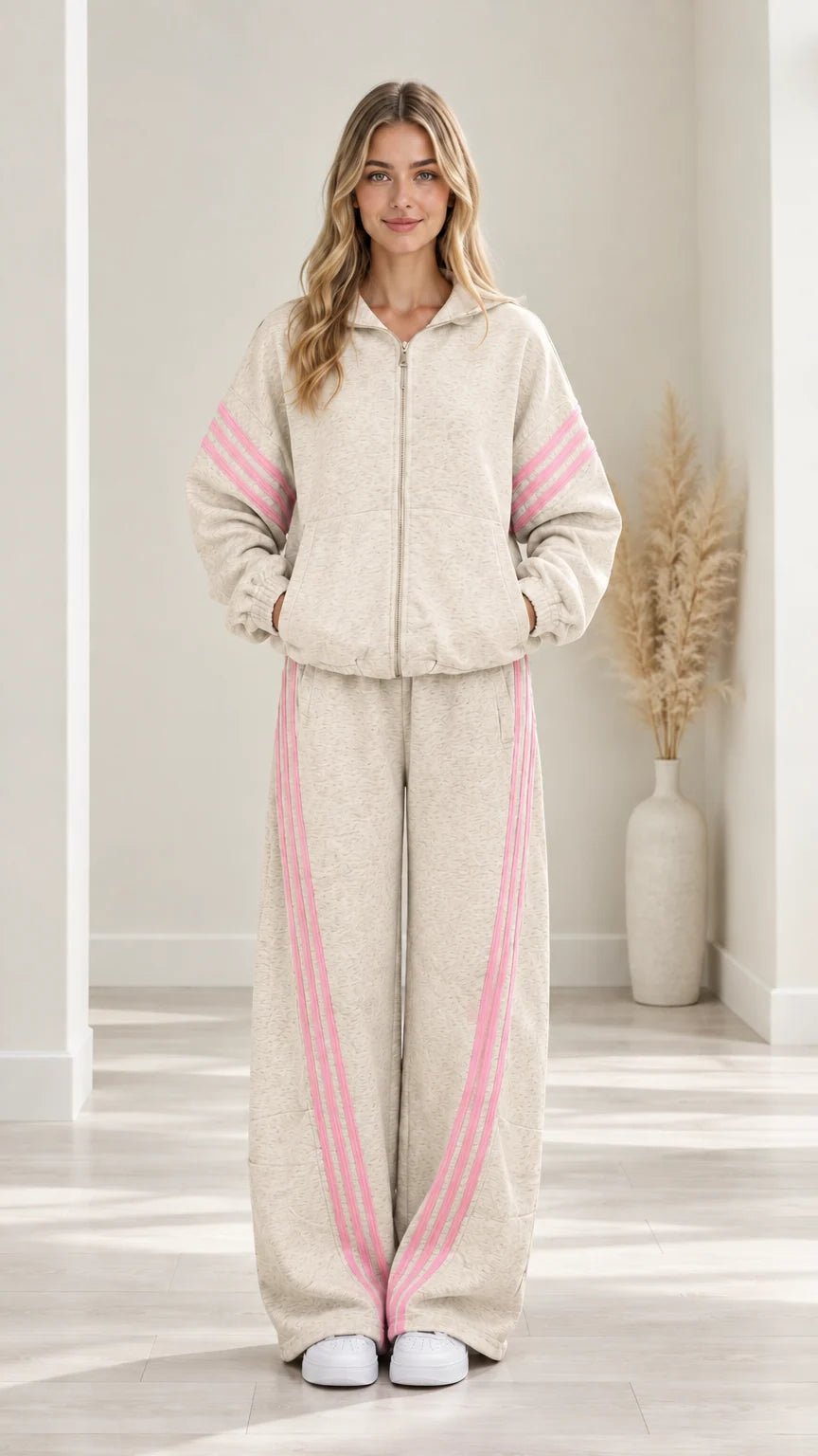 Woman modeling Oatmeal two-piece fleece tracksuit set with pink contrast stripes