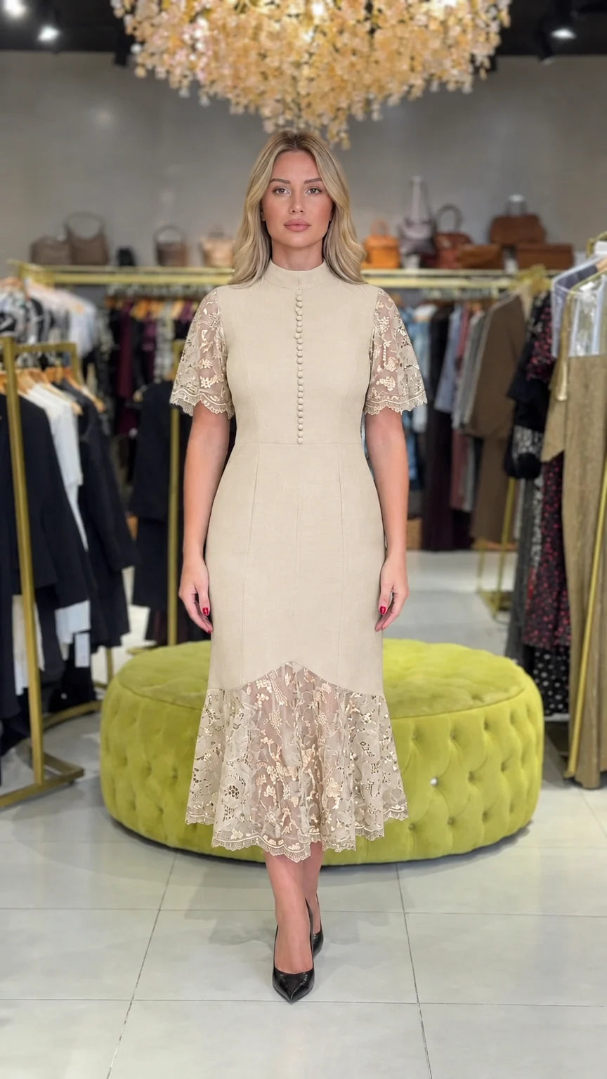Model wearing champagne beige mock neck lace midi cocktail dress
