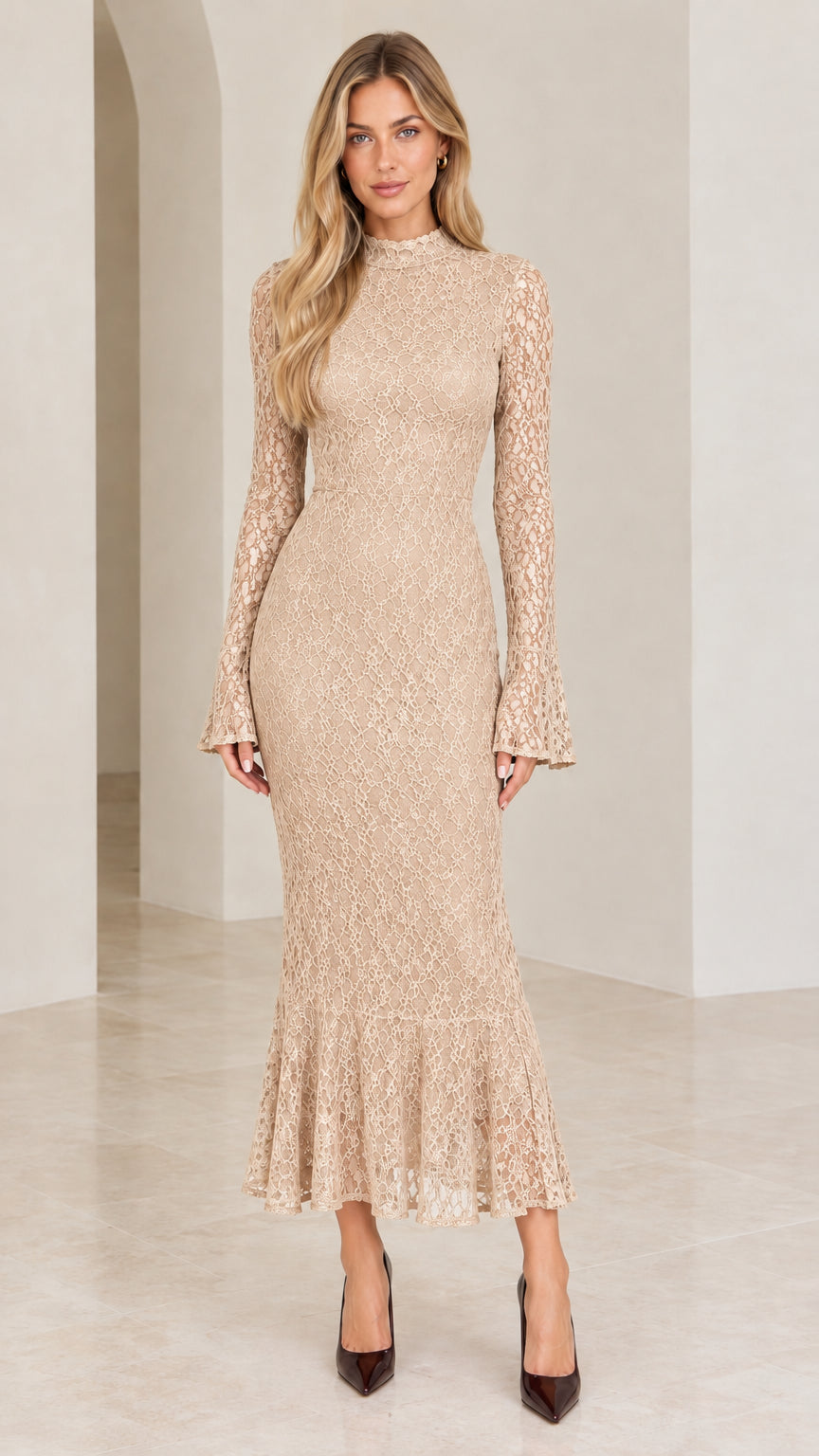 Front view of woman wearing champagne beige lace mock neck long sleeve mermaid dress