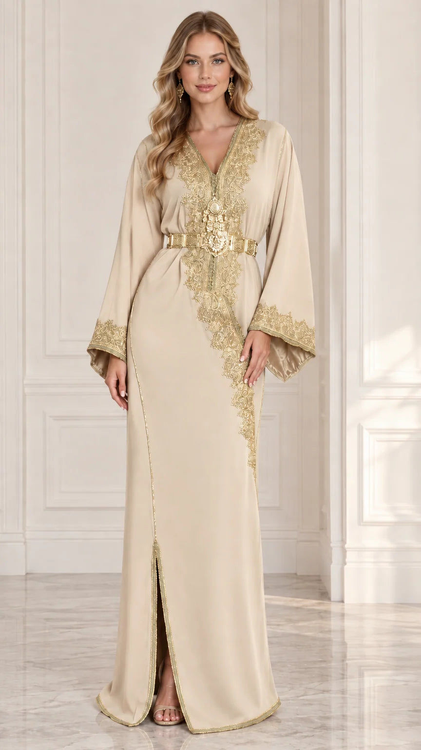 Front view of model wearing champagne beige Moroccan kaftan dress with gold embroidery and belt