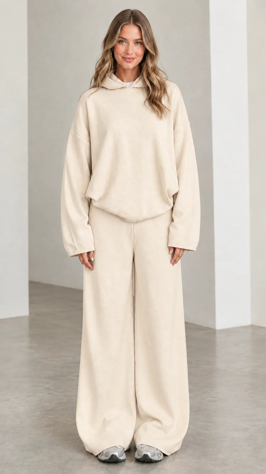 Front view of woman wearing Beige oversized hoodie and wide leg sweatpants lounge set