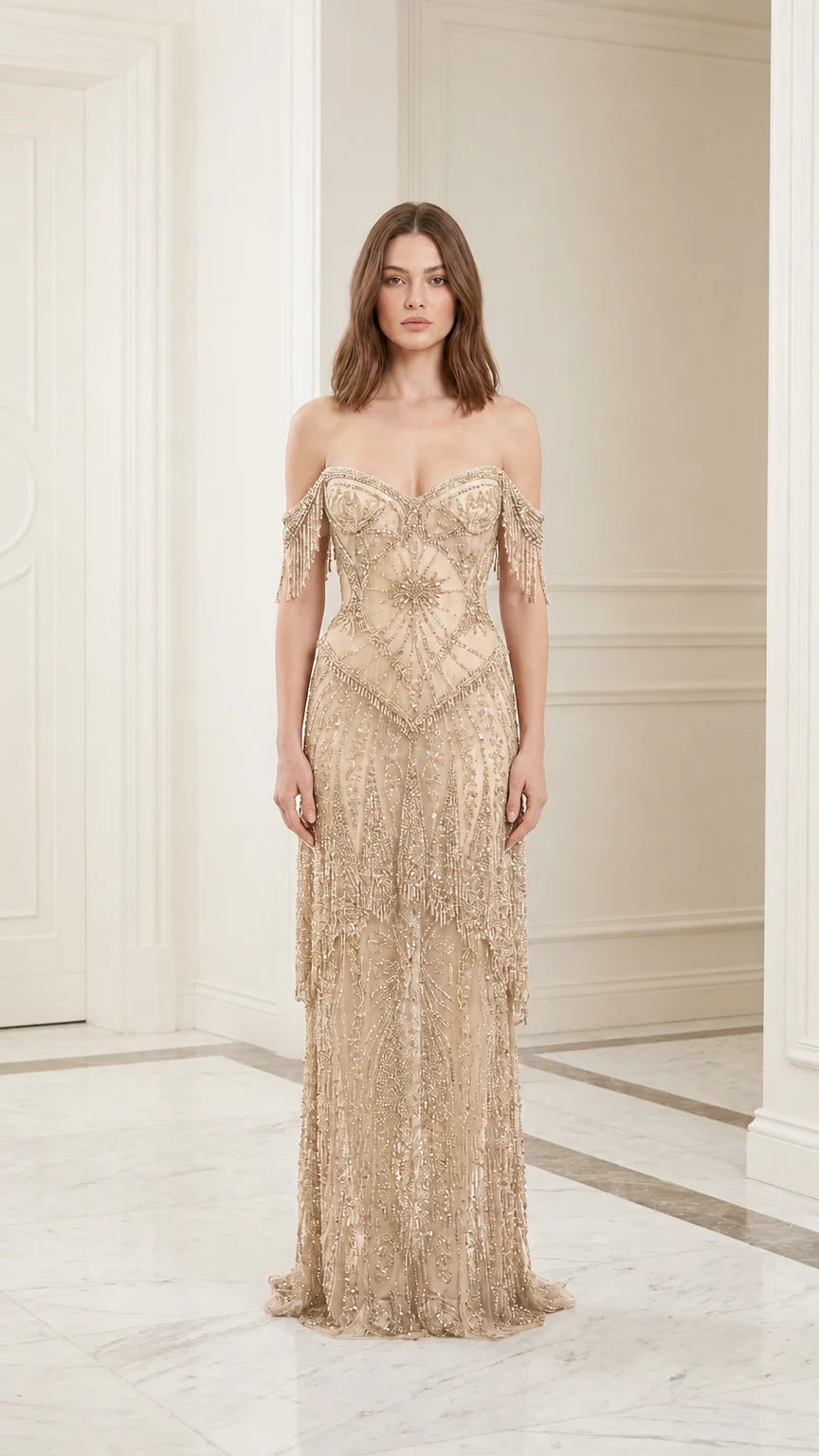 Model wearing champagne beaded evening gown, front view