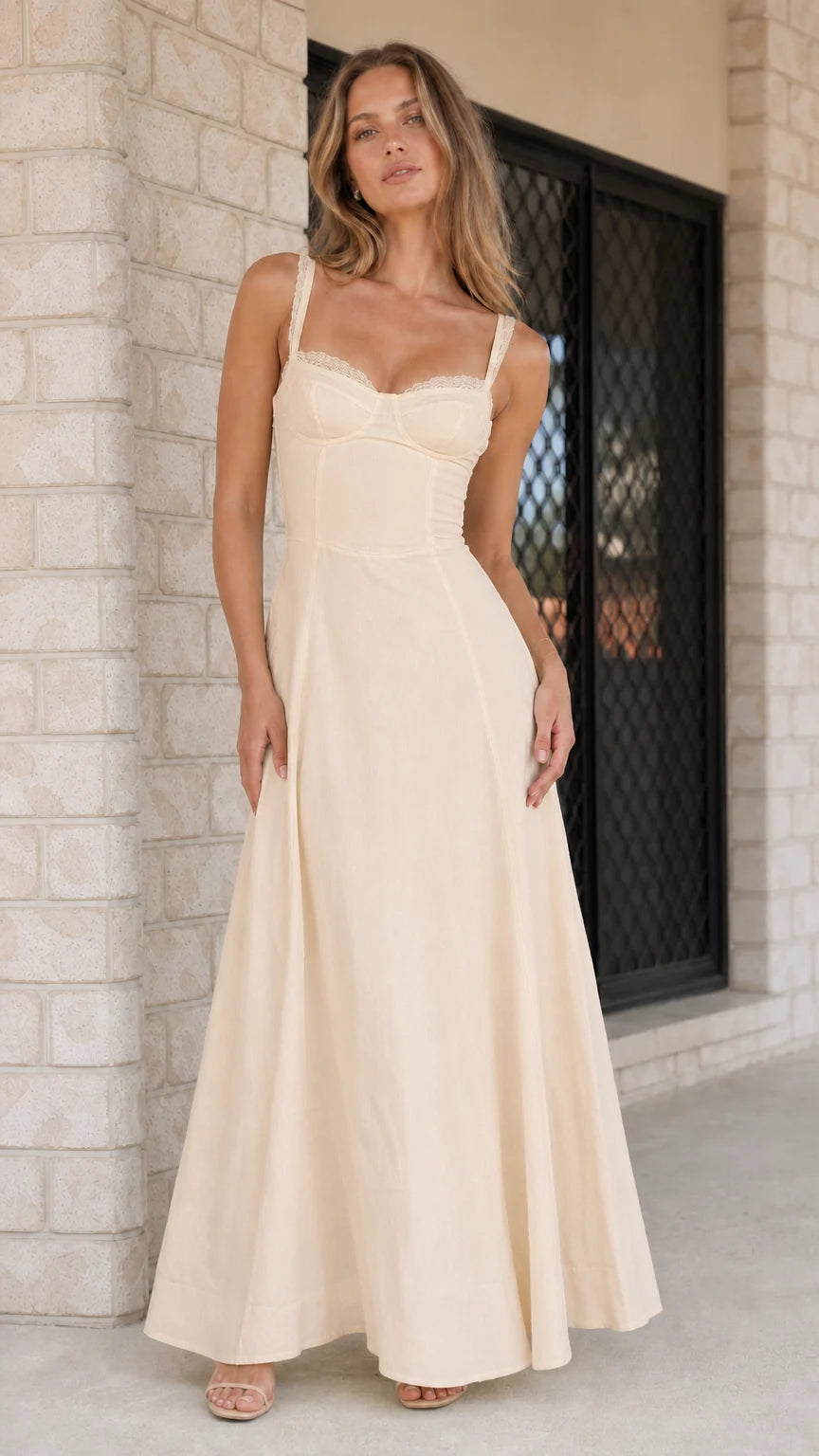 Woman wearing champagne neutral corset maxi dress