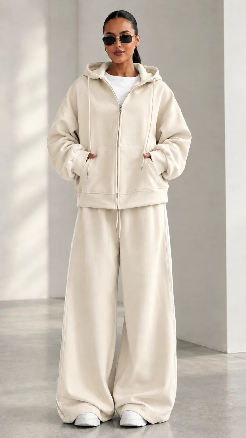 Model wearing Cream beige zip-up hoodie and matching wide-leg track pants set