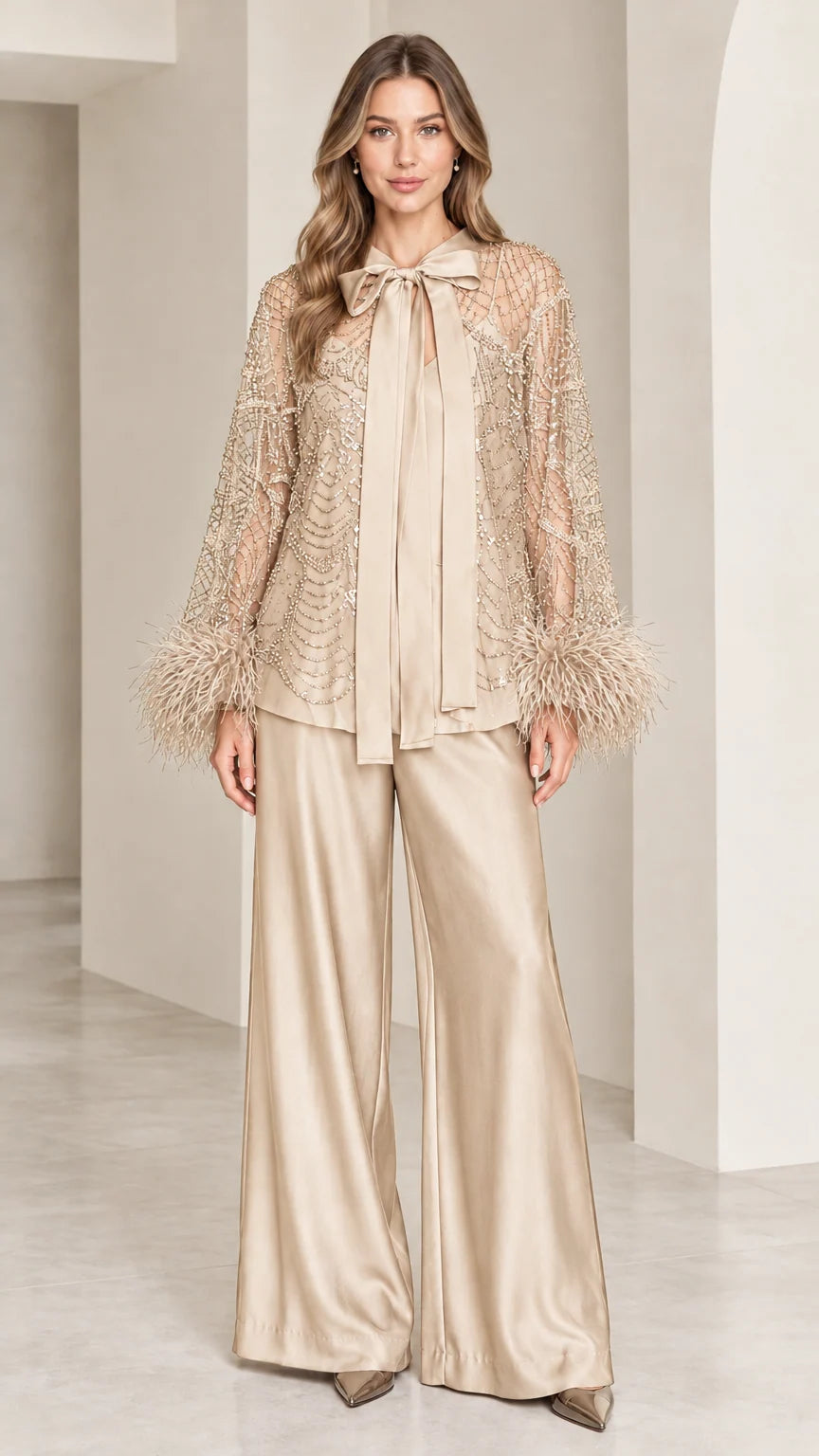 Champagne gold sequined top with feather cuffs and wide-leg satin pants