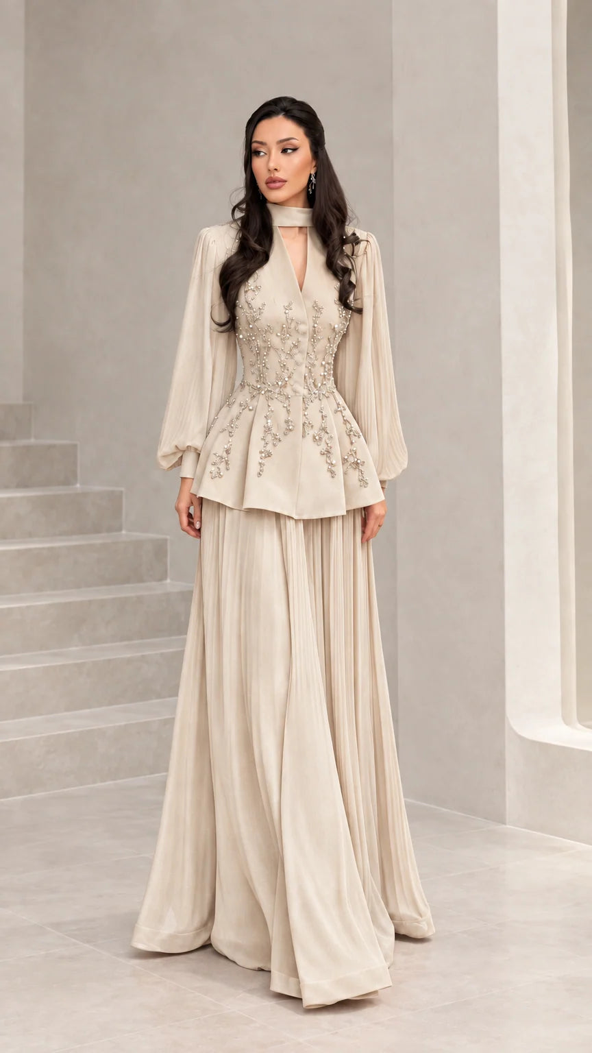 Front view of champagne beige long-sleeve embellished peplum evening dress