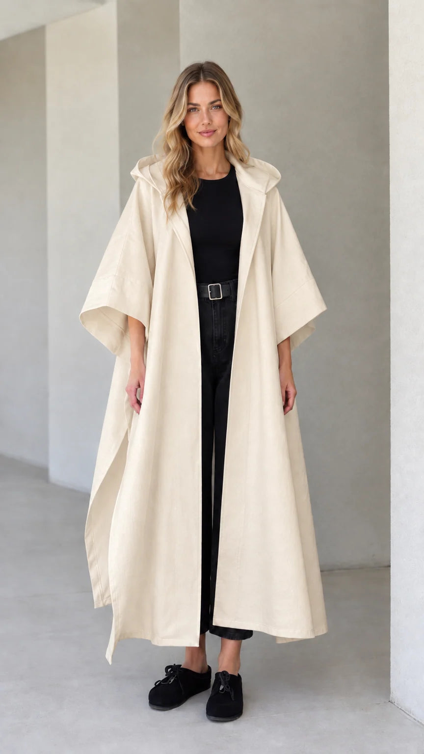 Model wearing cream beige hooded maxi canvas cape coat