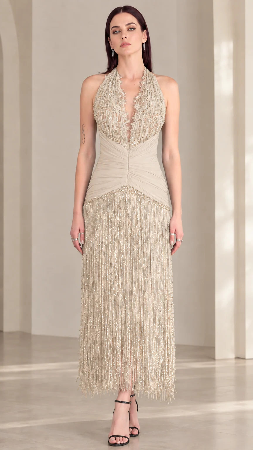 Front view of champagne beige halter sequin fringe evening dress