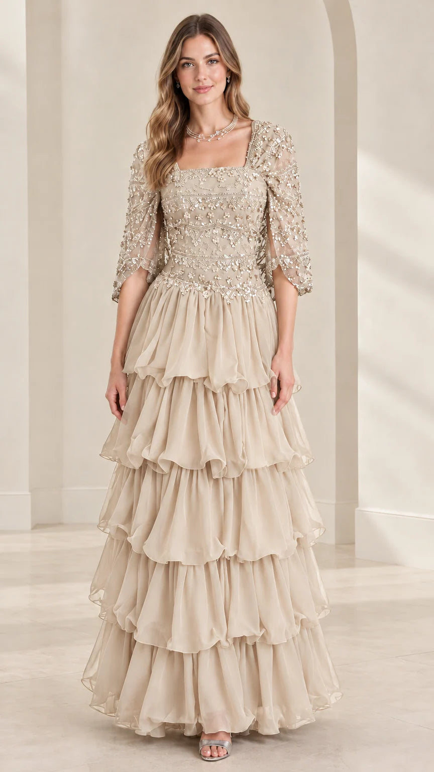 Full view of champagne beige beaded square neck tiered ruffle formal gown