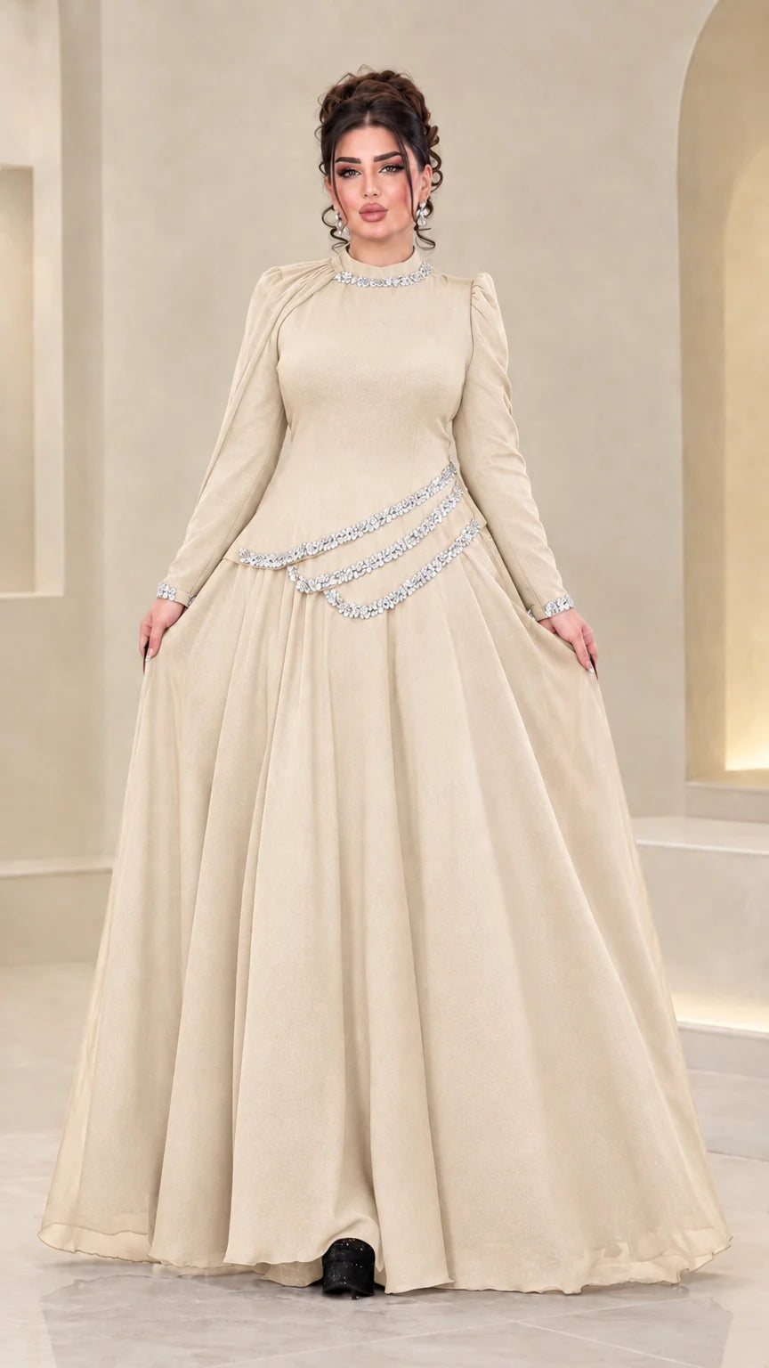 Front view of model wearing champagne beige rhinestone chiffon maxi gown