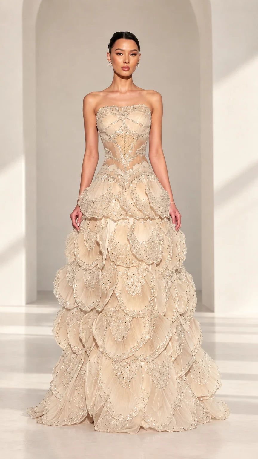 Front view of strapless beaded corset petal evening gown in Champagne