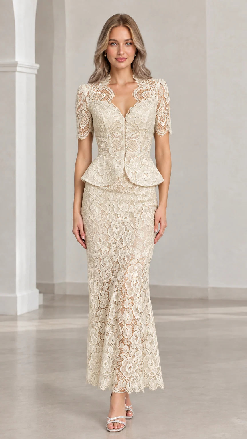 Front view of woman wearing champagne floral lace peplum maxi two-piece set