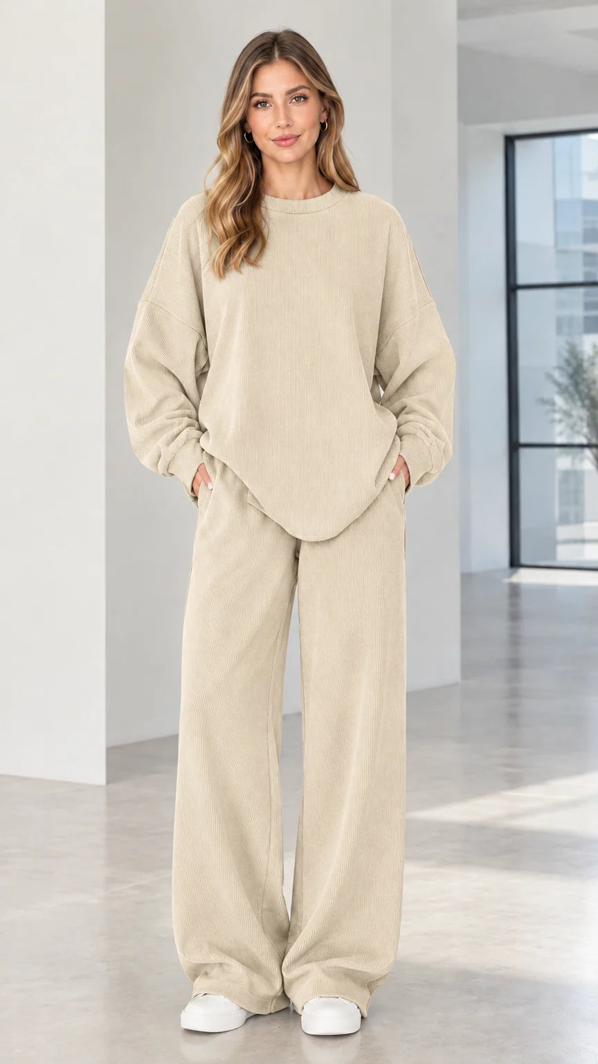 Woman wearing beige cream two-piece ribbed wide-leg lounge set