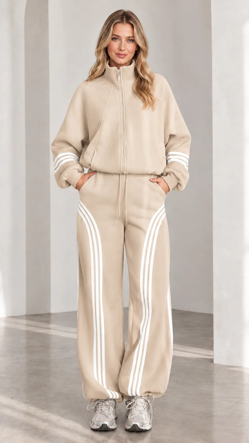 Front view of woman wearing beige two-piece striped tracksuit set