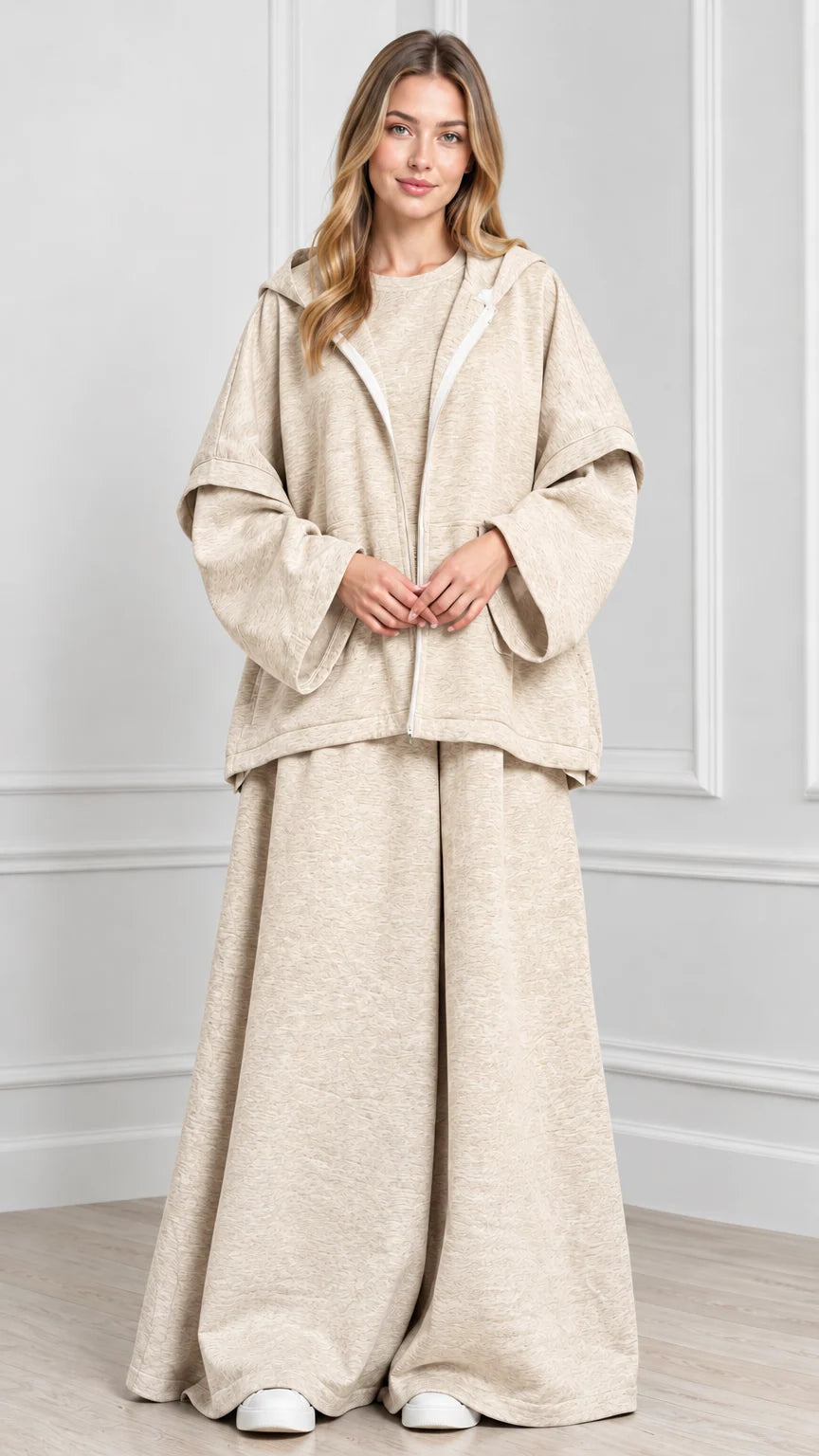 Front view of woman wearing Oatmeal beige hooded cape jacket and wide-leg pants set